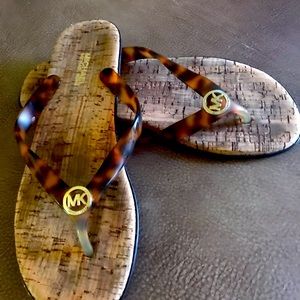 Michael Kors, tortoise flip flops with cork style soles.AG